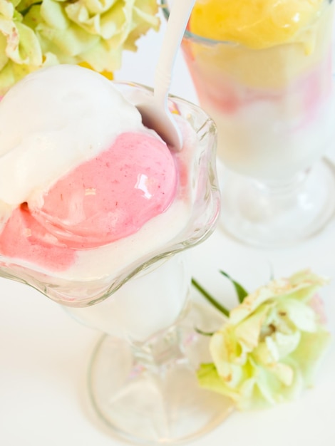 Scoop of delicious Italian fresh ice cream on white background.