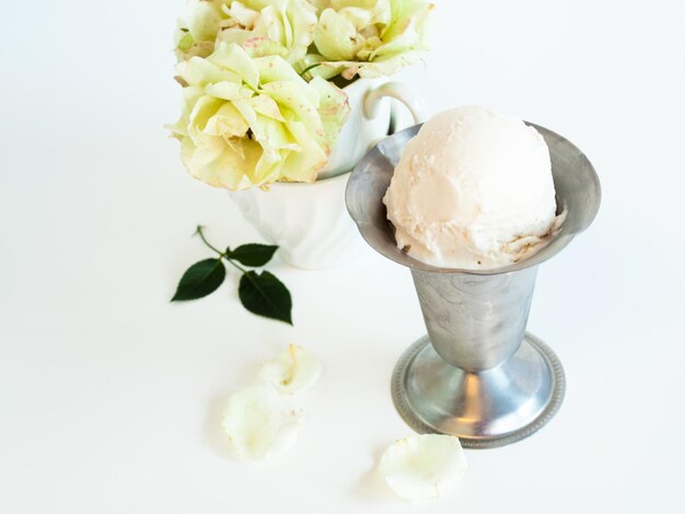 Scoop of delicious Italian fresh ice cream on white background.