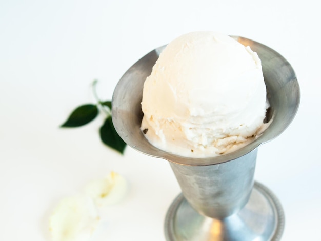 Scoop of delicious Italian fresh ice cream on white background.