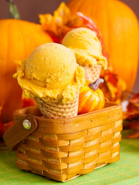 Scoop of gourmet pumpkin gelato in waffle cones.