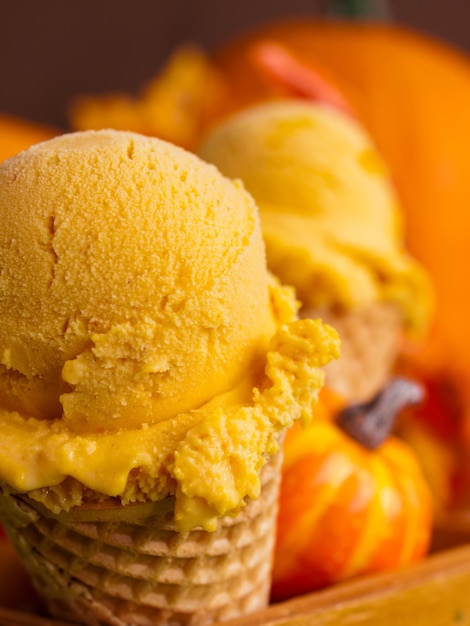 Photo scoop of gourmet pumpkin gelato in waffle cones.