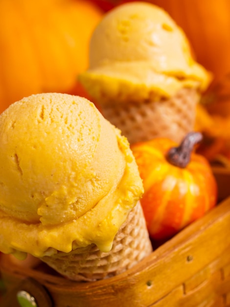 Scoop of gourmet pumpkin gelato in waffle cones.