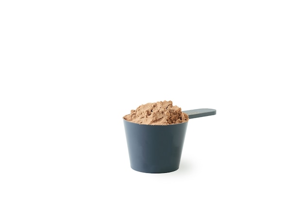 A scoop of protein powder isolated on white