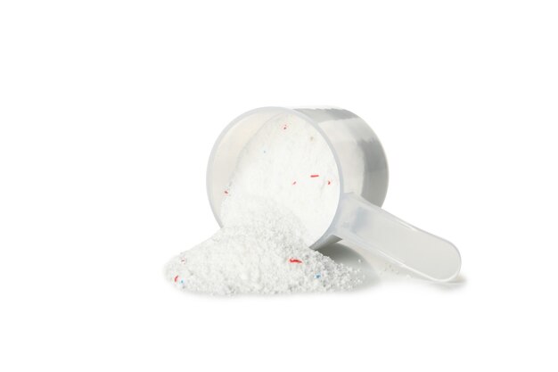 Scoop with washing powder isolated on white table