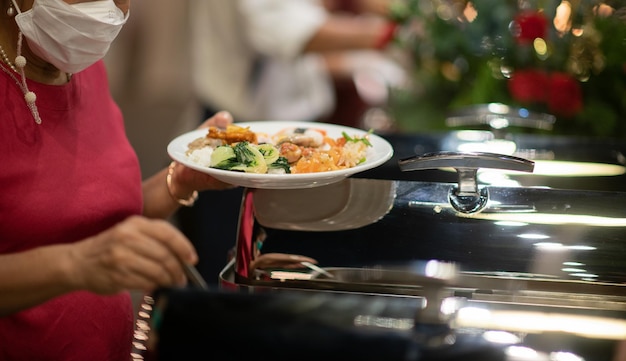 Scooping the food catering dinner time