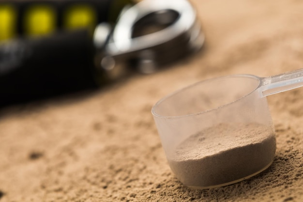 Photo scoops filled with protein powders for fitness nutrition to start training