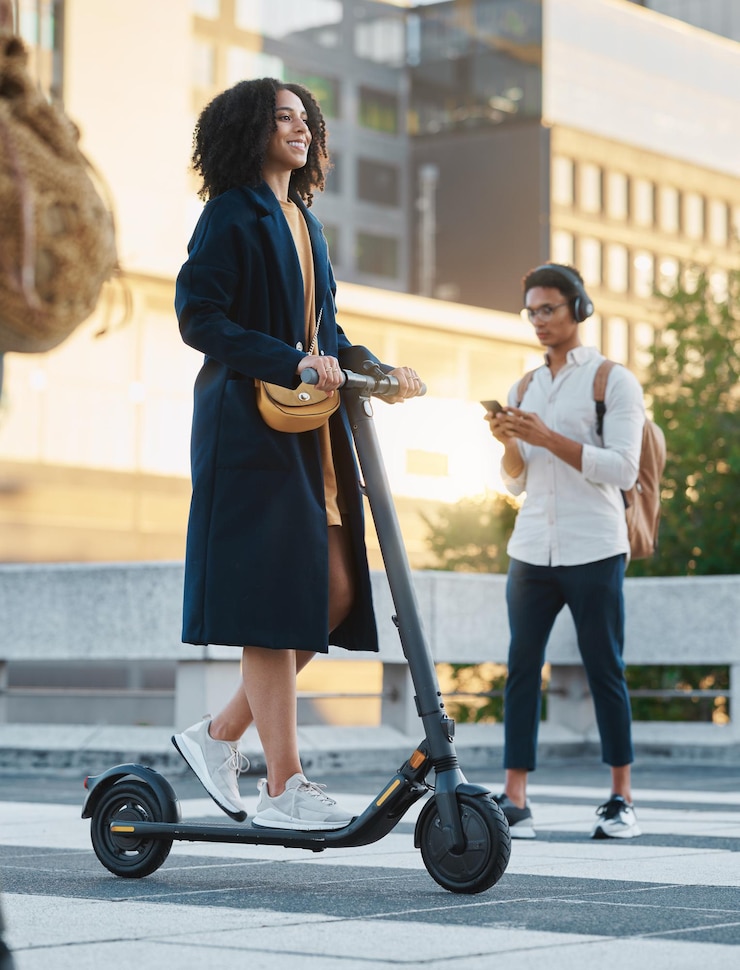 Photo scooter city and business woman going to work with an electric vehicle on an outdoor street in mexico travel happy and professional female corporate manager commuting to the office in urban town