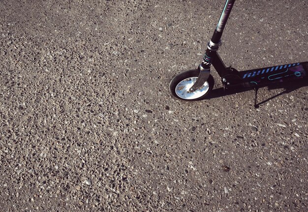 Scooter on the gray asphalt