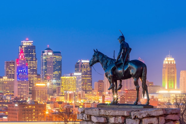 The scout overlooking downtown kansas city. the scout is a famous statue(108 years old statue). it was conceived by dallin in 1910