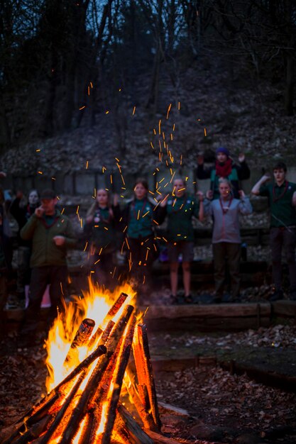 Scouts standing together around a fireplace