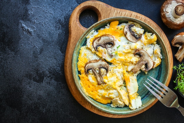 Scramble fried eggs omelet mushrooms