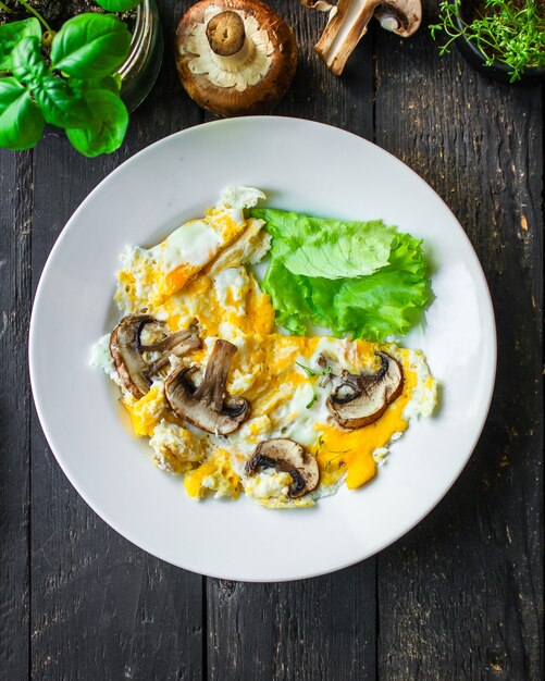 Scramble fried eggs omelet with mushroom