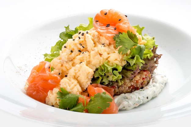 Scramble with quinoa salmon and Philadelphia cheese On white background