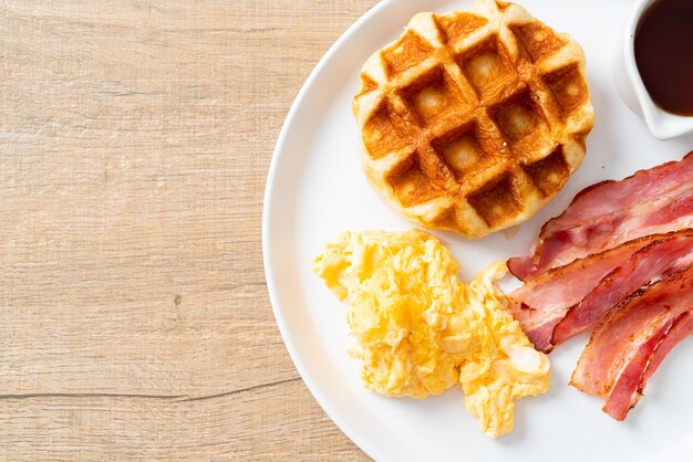 scrambled egg with bacon and waffle for breakfast