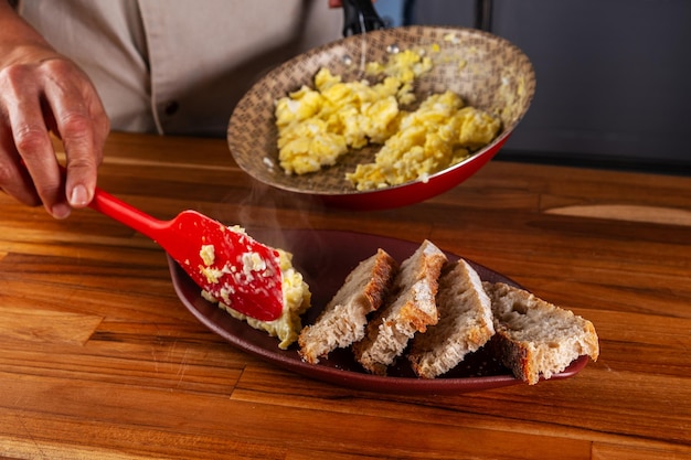 scrambled eggs and slices of artisan bread