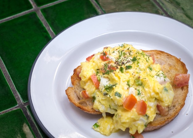 Scrambled eggs on toast bread