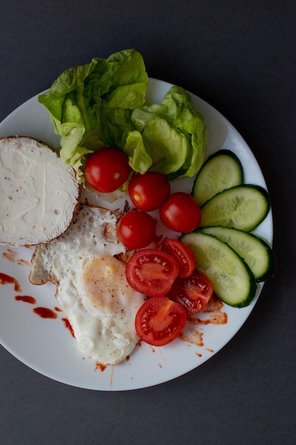 Scrambled eggs with toast and vegetables a great breakfast with coffee and juice