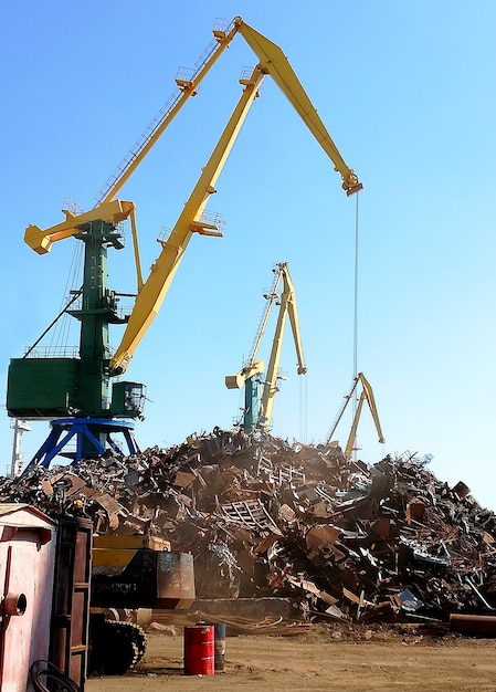 scrap metal crane with a lot of metal in seaport