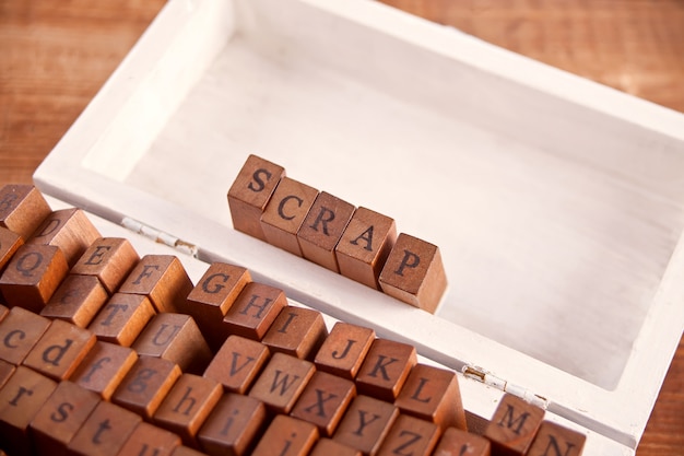 Photo scrapbooking wooden alphabet stamp set with text scrap