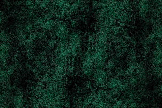 Scratched dark green old concrete wall surface with heavy grunge texture for background