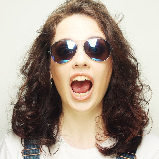 Screaming curly girl with sunglasses