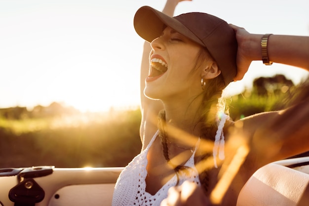 Screaming girl riding a car