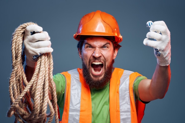 Photo screaming man cropped view of orange hard hat emotion professional