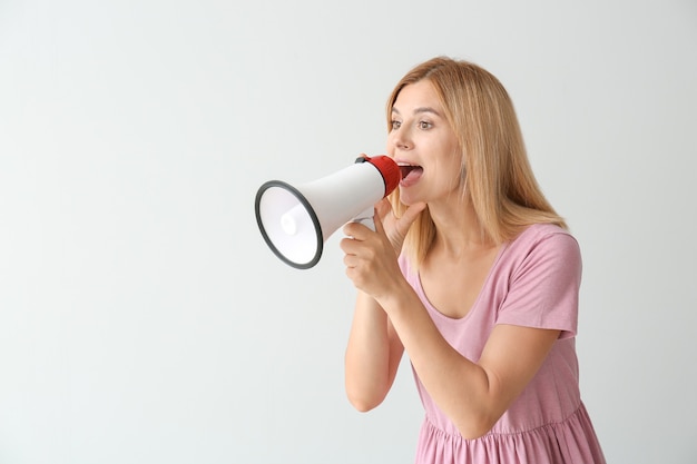 Screaming woman with megaphone