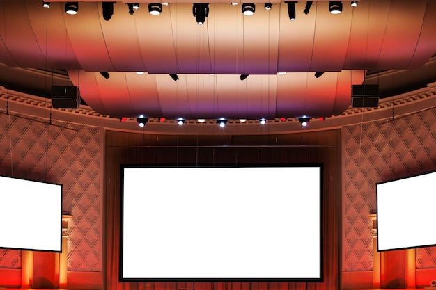 Photo screens in red and brown illuminated cinema