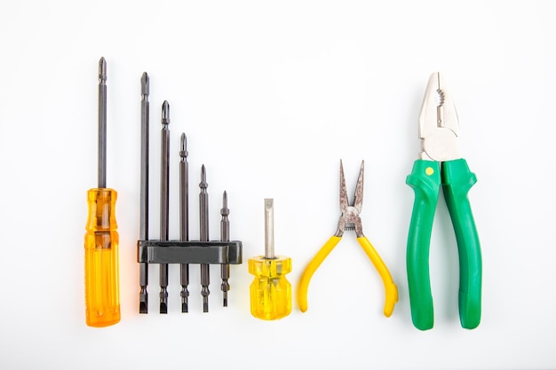 Screwdrivers and pliers on white backgrounds