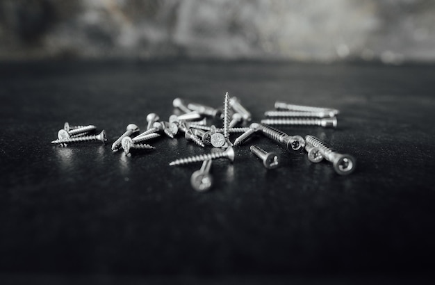 Screws for construction on a dark background
