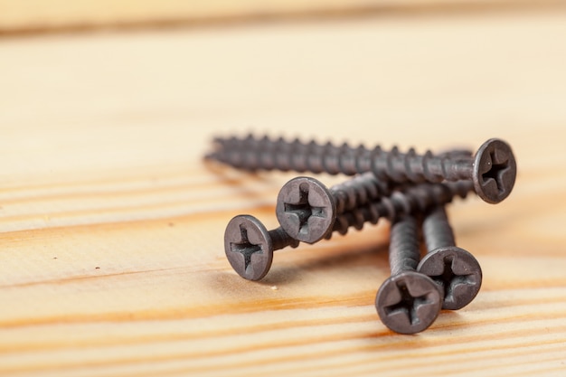 Screws on a wooden table