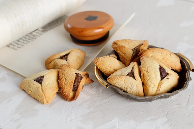 Scroll of Esther and haman's ears cookies Concept Jewish holiday Purim