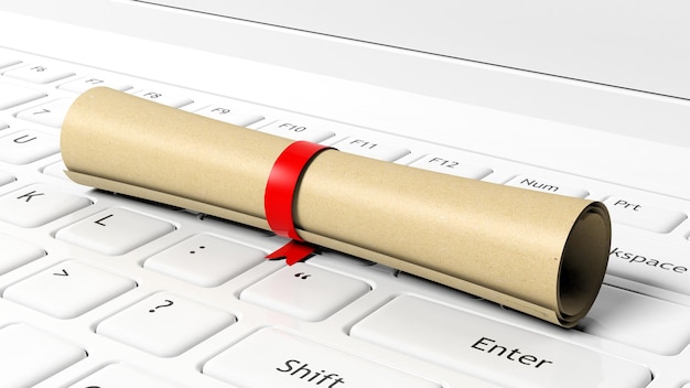 Photo scroll with red ribbon on laptop keyboard