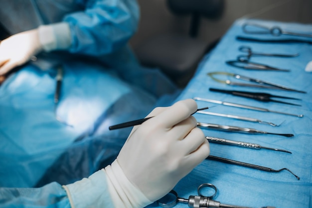 Photo scrub nurse preparing medical instruments for operation