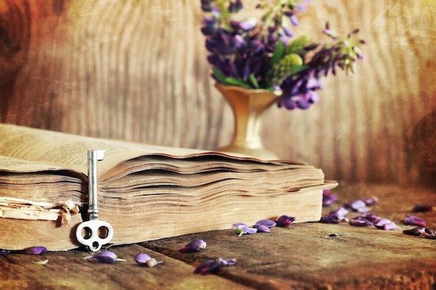 Sctrathes effect on photo retro book on wooden table key