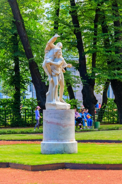 Sculptural composition Kidnapping of the Sabine Woman in old city park Summer Garden in St Petersburg Russia