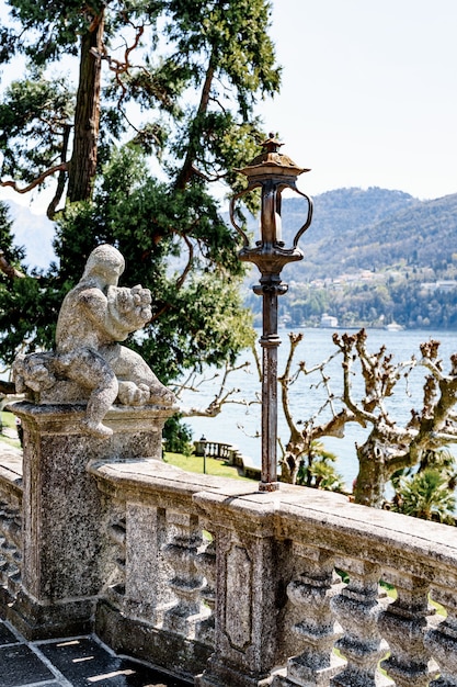 Sculpture on a balustrade in teresio olivelli park como italy