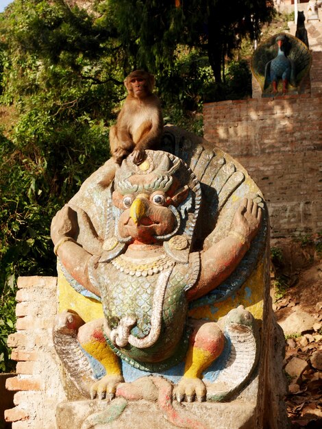 Sculpture carving stone figure garuda or galon or nan belu guardian at ancient antique of Swayambhunath pagoda or Monkey Temple for nepali people and foreign travelers travel visit in Kathmandu Nepal