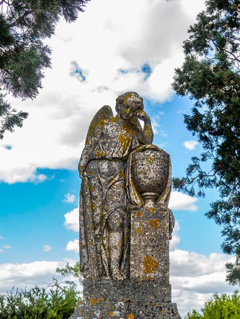 Sculpture of a stone angel in an ancient cementery