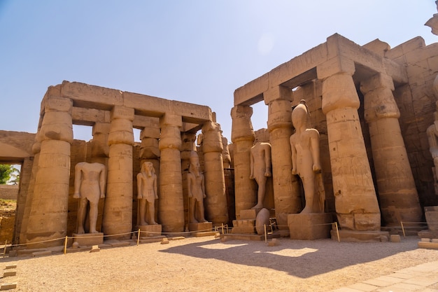 The sculptures of pharaohs and ancient Egyptian drawings on the columns of the Luxor Temple