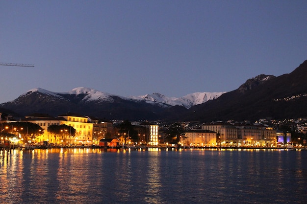 sea against buildings and mountains