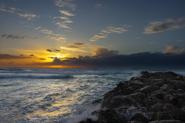 sea against sunset background