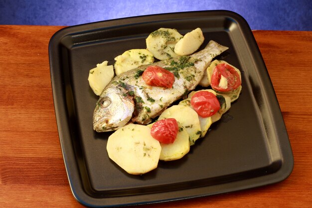 sea bass baked and potatoes