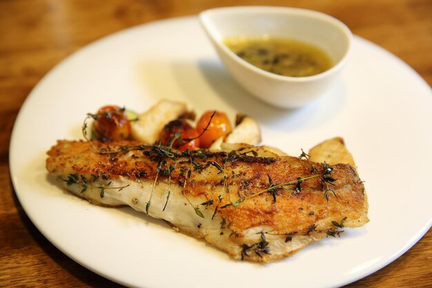 Sea bass fillet on wood background