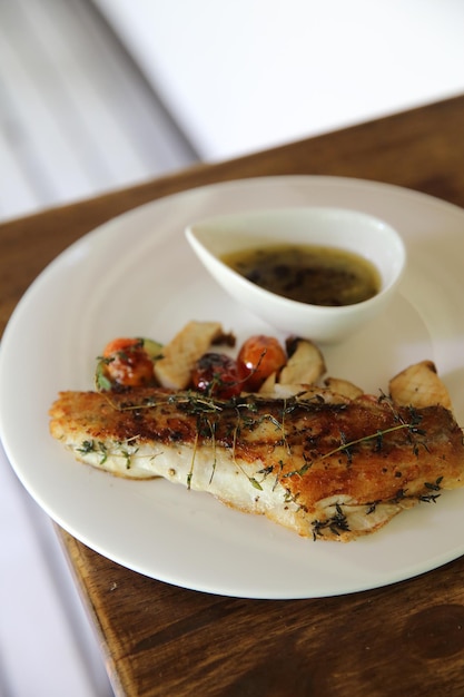 Sea bass fillet on wood background