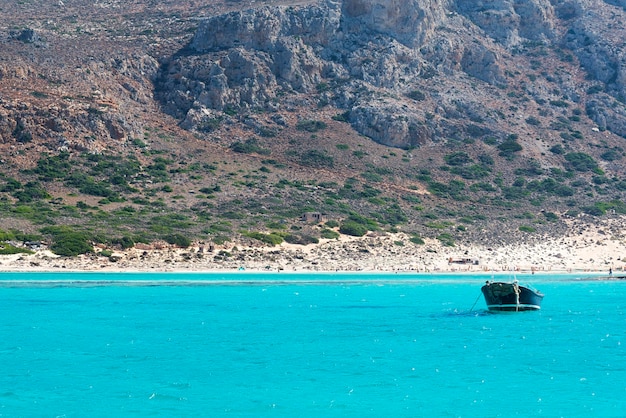 Sea beach mountain and the boat