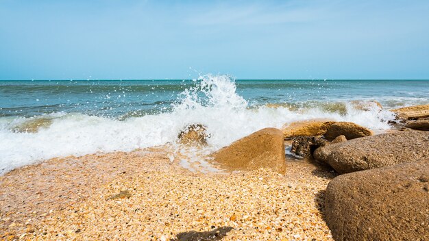 Sea beach with large boulders