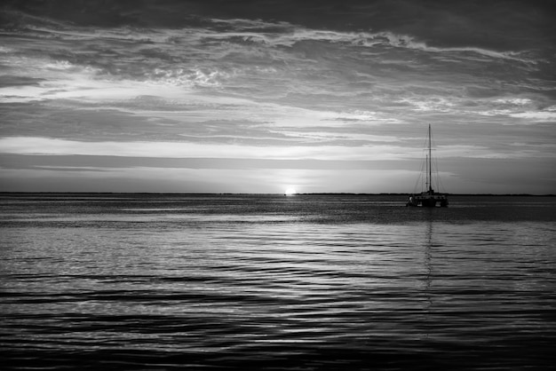 Sea boats at sunset ocean yacht sailing on water yachting