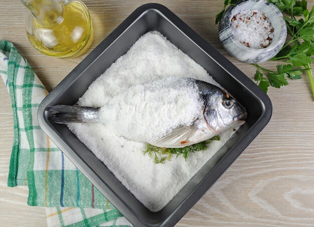 Sea bream (Dorado) baked in the shell of salt